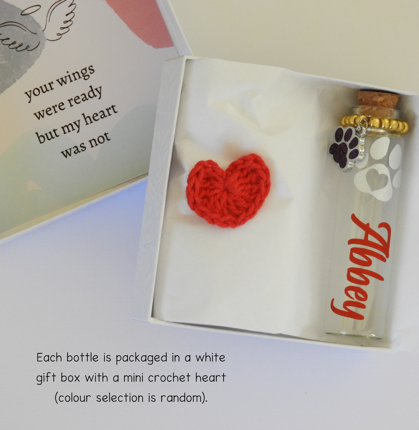 Each bottle is carefully packaged in a white box and includes a small crochet heart (colour selected at random). 