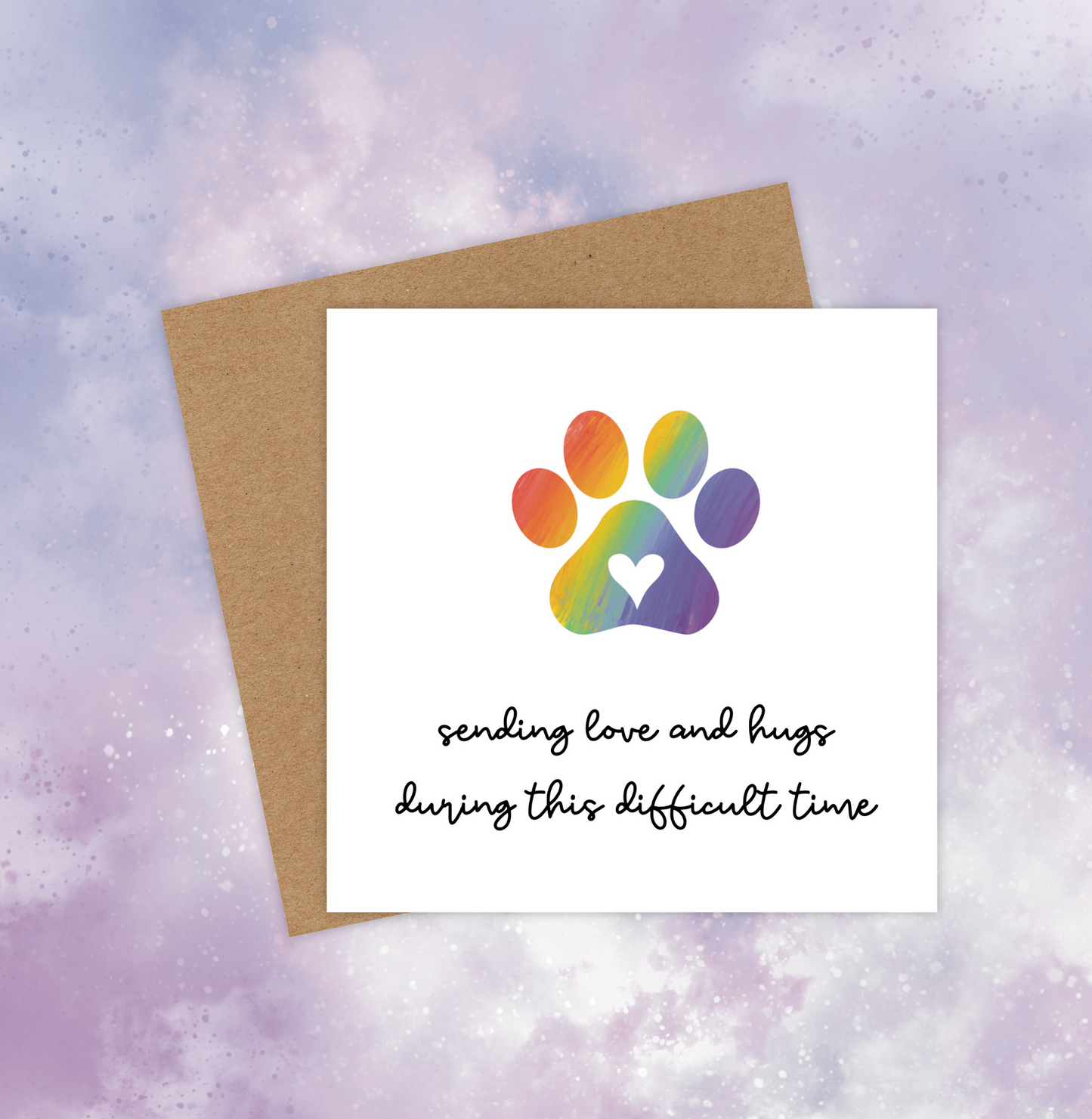 This pet sympathy card features a rainbow-coloured paw print in the centre and the text below reads, “Sending love and hugs during this difficult time.”