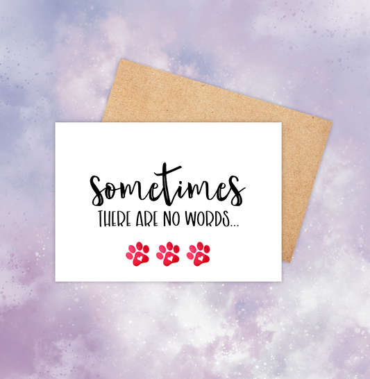 The pet sympathy card reads, “sometimes there are no words.” The text is centred and has three red paw prints below the text.