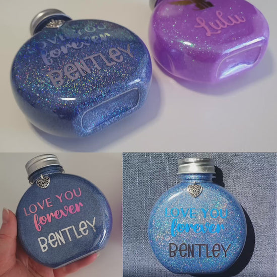 A video displaying the holographic glitter and shiny vinyl text on a bottle.