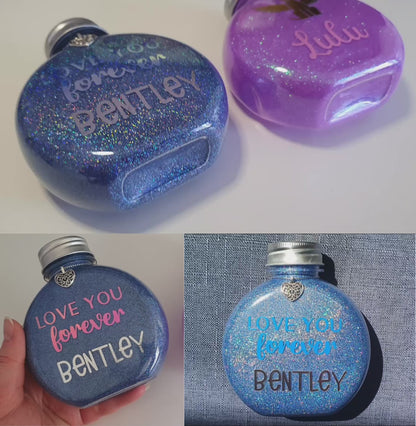 A video displaying the holographic glitter and shiny vinyl text on a bottle.